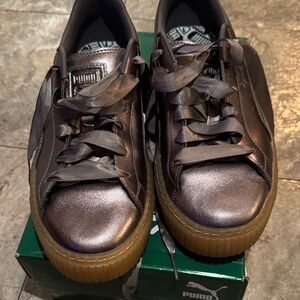 Puma women’s Metallic Brown Sneakers